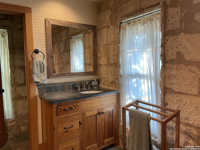 bathroom featuring vanity, tile patterned floors, and plenty of natural light