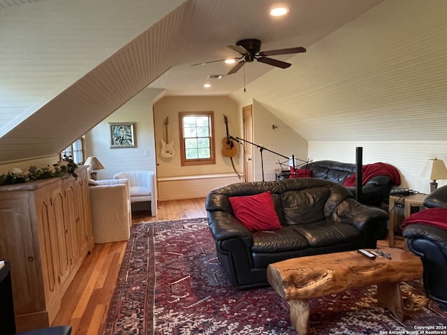 interior space with vaulted ceiling, ceiling fan, and hardwood / wood-style flooring