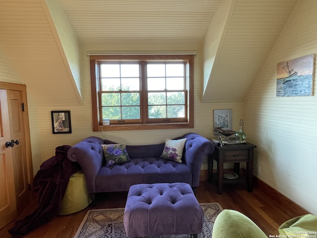 living room featuring wood-type flooring and lofted ceiling