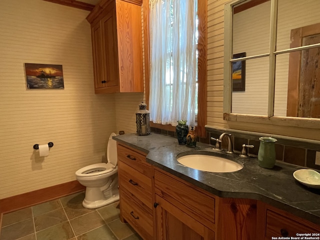 bathroom featuring vanity, toilet, and tile patterned floors