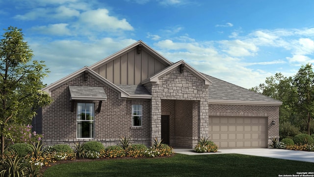 view of front of home featuring a front yard and a garage