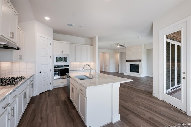 kitchen with white cabinets, sink, and appliances with stainless steel finishes