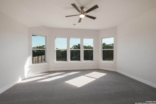 empty room with carpet floors and ceiling fan