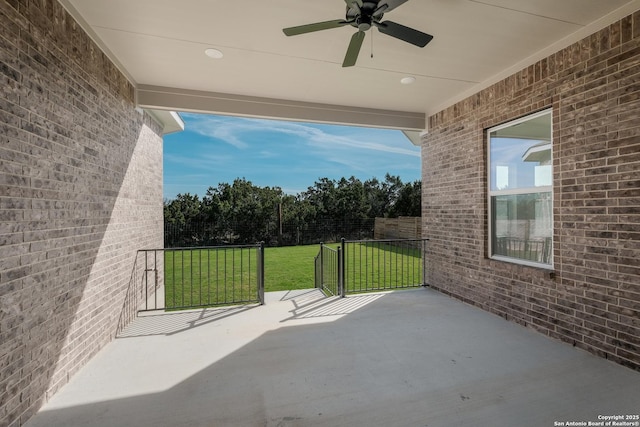 view of patio featuring ceiling fan