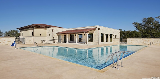 view of pool featuring a patio area