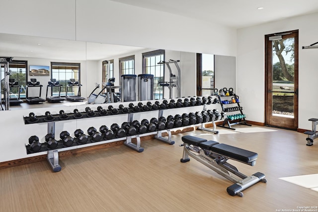 workout area with wood-type flooring