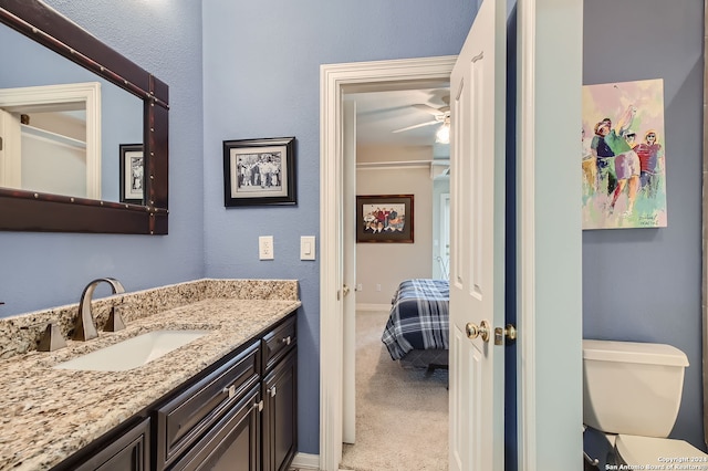 bathroom with vanity and toilet