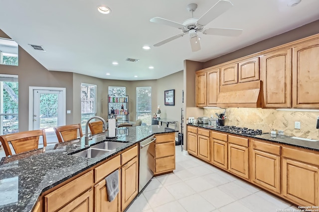 kitchen featuring a sink, open floor plan, a ceiling fan, and stainless steel appliances