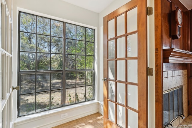 doorway to outside with plenty of natural light and parquet floors