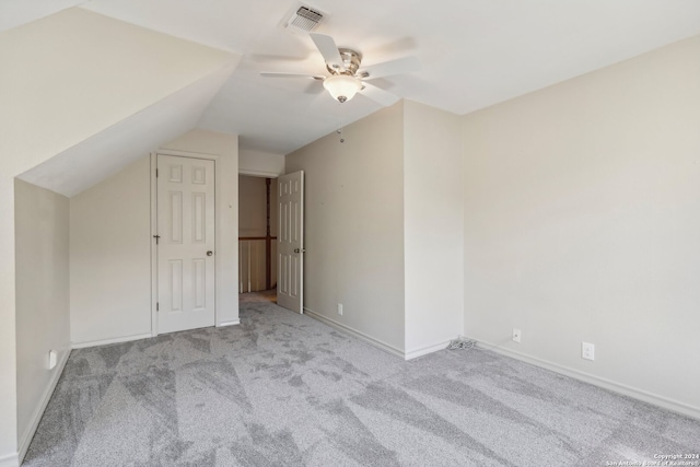 bonus room featuring lofted ceiling, light colored carpet, and ceiling fan