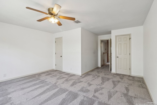 unfurnished room with light carpet and ceiling fan