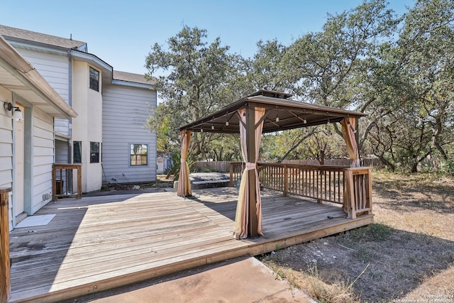 wooden deck featuring a gazebo