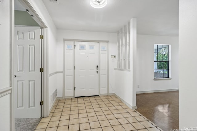 entryway with light parquet flooring