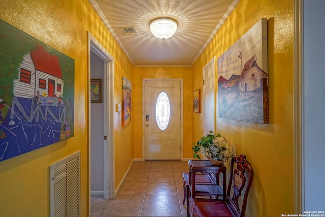 entryway featuring tile patterned flooring and ornamental molding