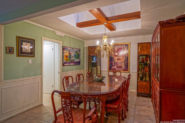 dining room featuring beam ceiling, a notable chandelier, crown molding, a textured ceiling, and light tile patterned flooring