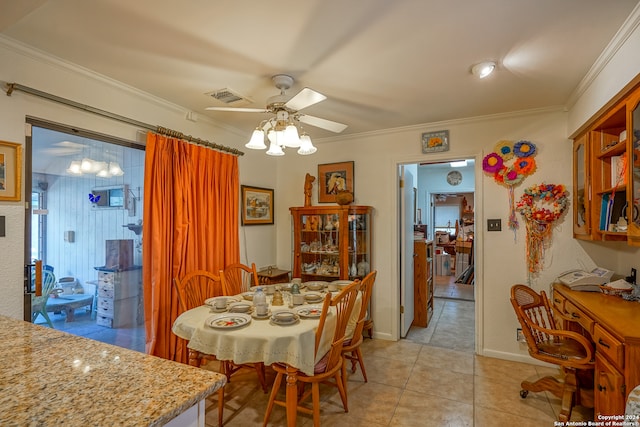 dining room featuring crown molding, ceiling fan, and light tile patterned flooring