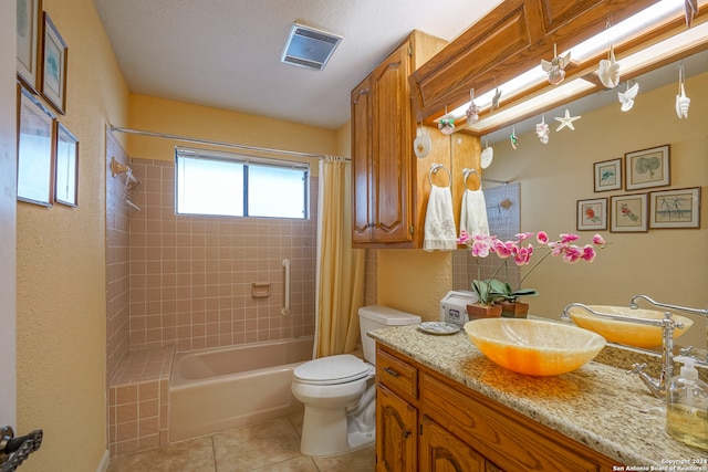 full bathroom with tile patterned floors, vanity, shower / tub combo, and toilet