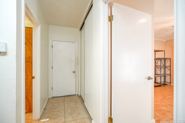 hall featuring light tile patterned flooring