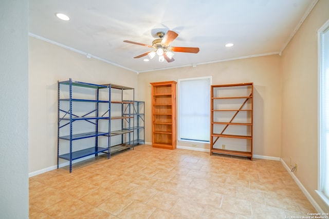 spare room featuring crown molding and ceiling fan