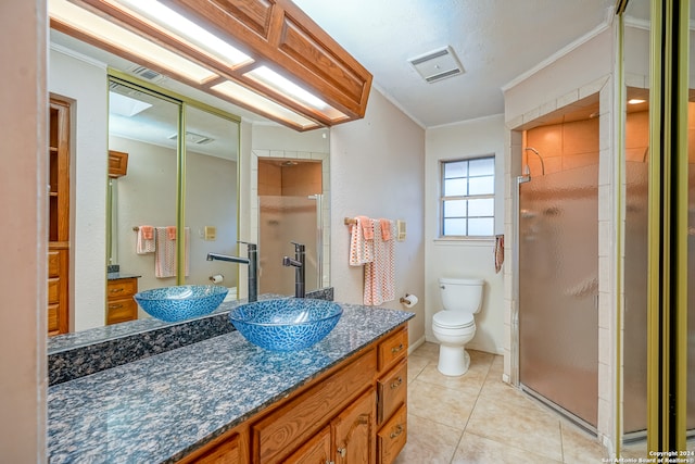 bathroom with tile patterned floors, an enclosed shower, ornamental molding, vanity, and toilet