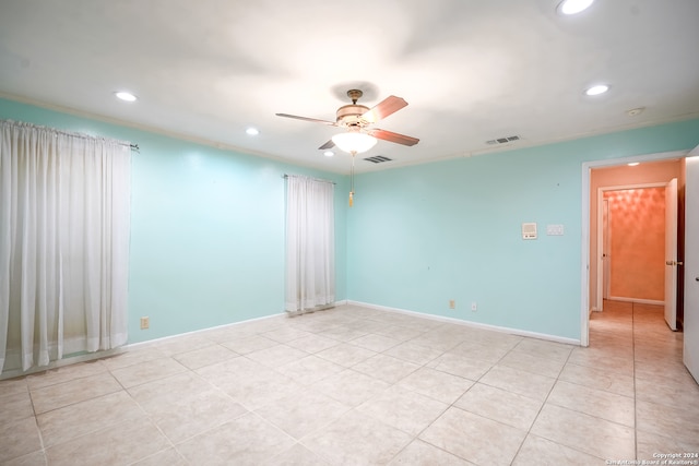 unfurnished room featuring ceiling fan and light tile patterned floors