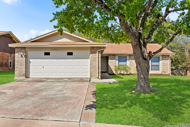 ranch-style home featuring a garage and a front lawn