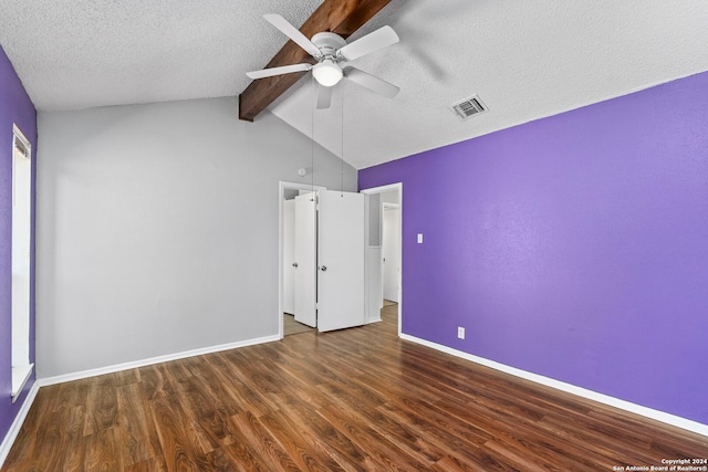 unfurnished bedroom featuring ceiling fan, beamed ceiling, a textured ceiling, high vaulted ceiling, and dark hardwood / wood-style flooring