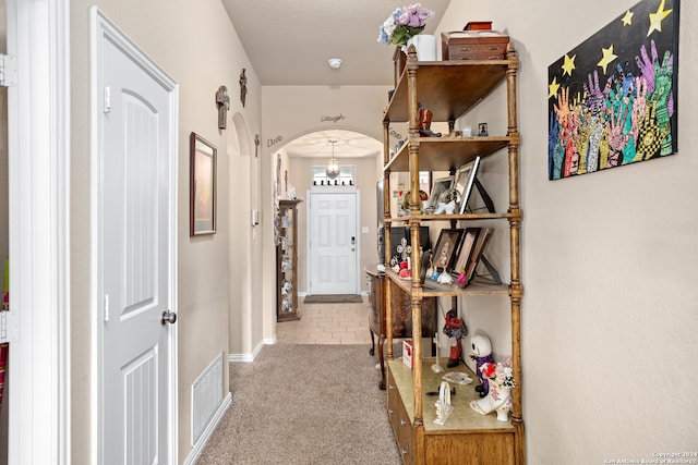 hallway with light carpet