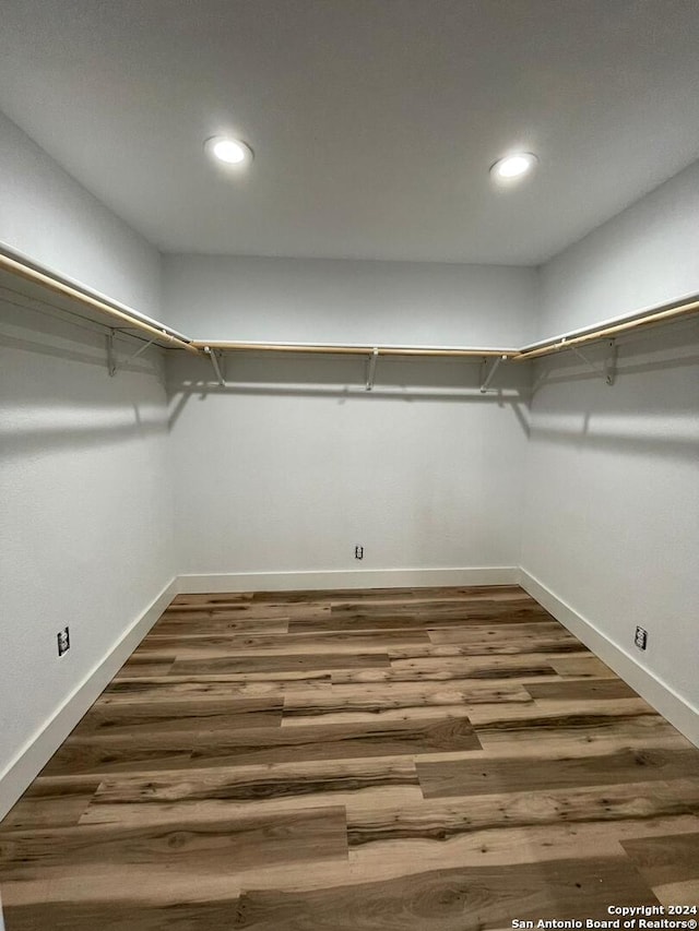 walk in closet featuring dark hardwood / wood-style flooring