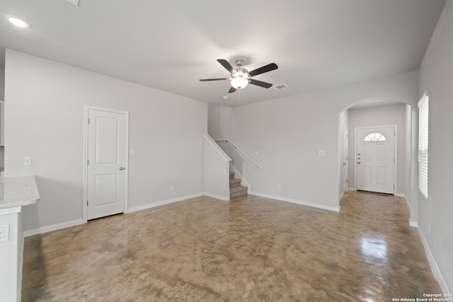 unfurnished living room featuring ceiling fan