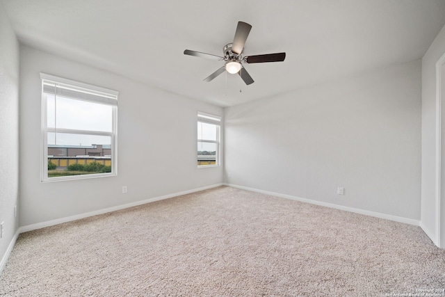 empty room with carpet floors and ceiling fan