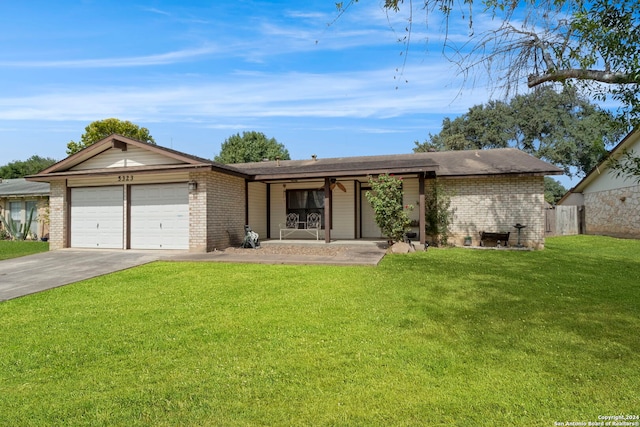 ranch-style home featuring a garage and a front yard