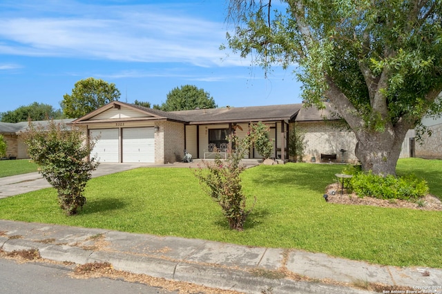 ranch-style home featuring a garage and a front yard