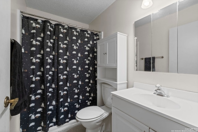 bathroom featuring a textured ceiling, curtained shower, vanity, and toilet