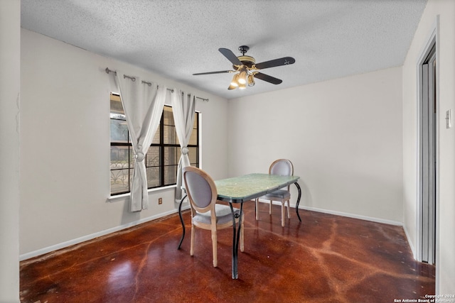 dining space featuring a textured ceiling and ceiling fan