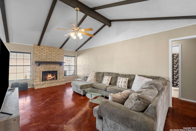 living room featuring ceiling fan, beamed ceiling, a fireplace, and a healthy amount of sunlight