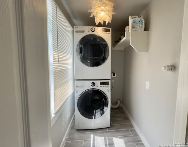 laundry room with stacked washer and clothes dryer