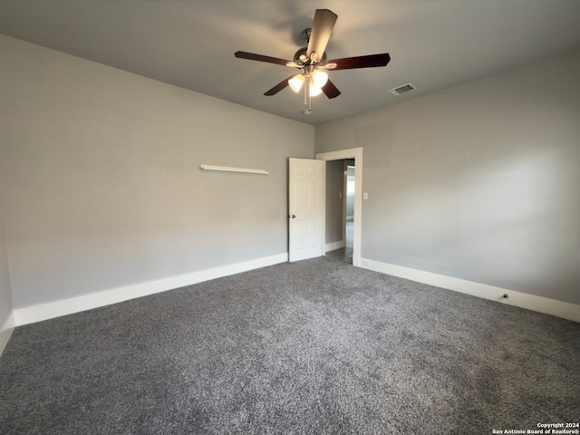 carpeted empty room with ceiling fan