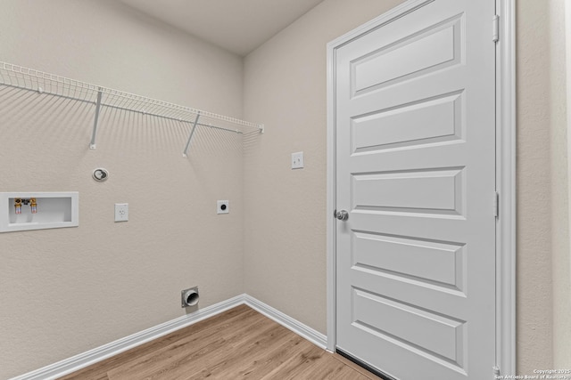 laundry room with hookup for a gas dryer, washer hookup, wood-type flooring, and hookup for an electric dryer