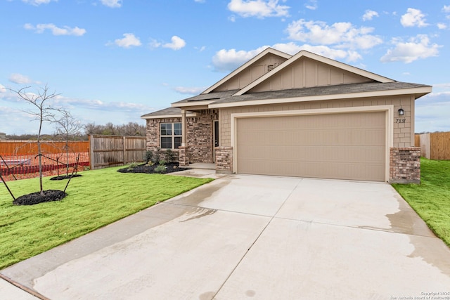 view of front of house featuring a garage and a front yard