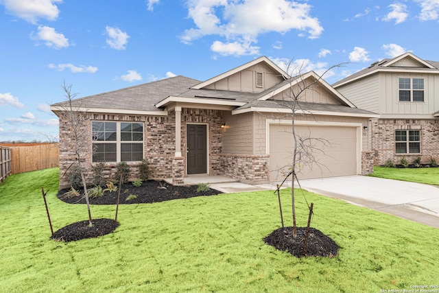 craftsman inspired home featuring a garage and a front yard