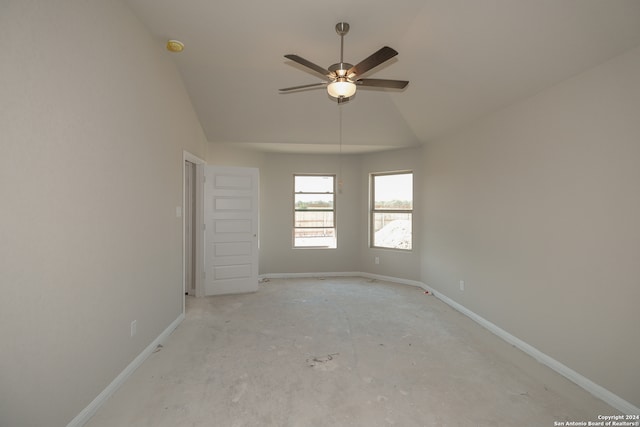 unfurnished room featuring ceiling fan and vaulted ceiling