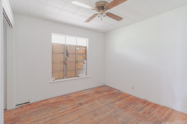 spare room featuring ceiling fan and hardwood / wood-style flooring