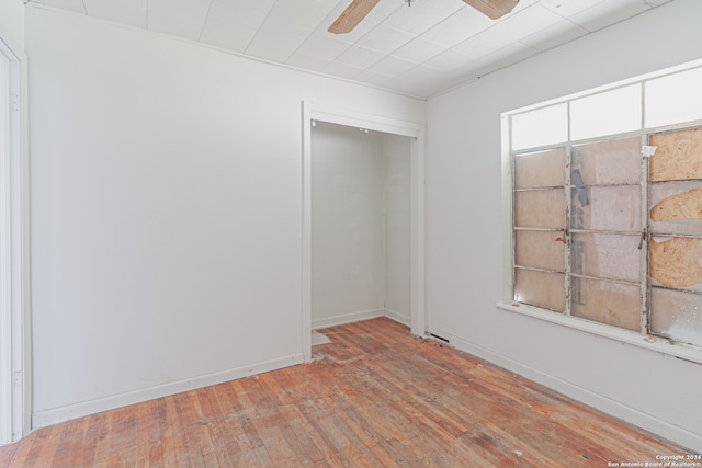 spare room with ceiling fan and hardwood / wood-style floors