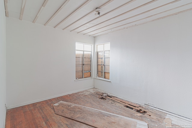 empty room featuring wood-type flooring