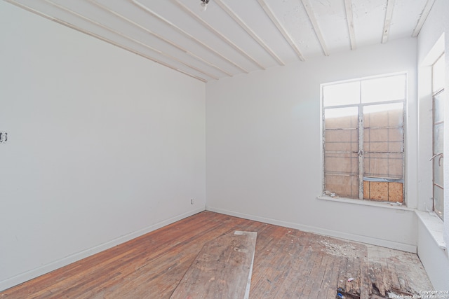 spare room with hardwood / wood-style floors