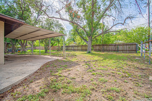 view of yard with a carport