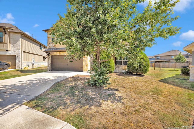 obstructed view of property featuring a front yard and a garage