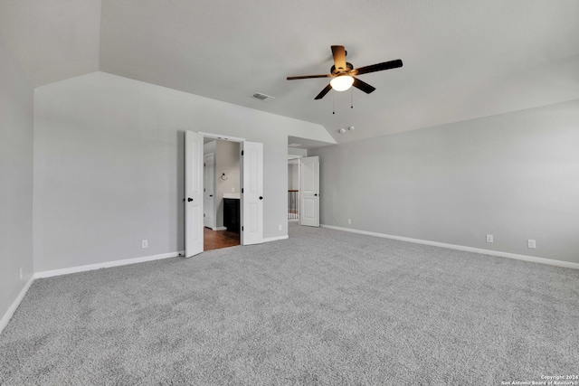 unfurnished bedroom with lofted ceiling, carpet flooring, and ceiling fan