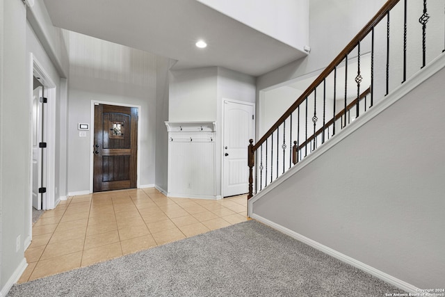 view of carpeted entrance foyer